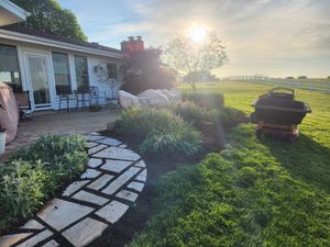 Enhance your garden's health and appearance with our professional mulch installation service, providing expert application to retain moisture, reduce weeds, and enrich soil for vibrant plant growth. Transform your landscape effortlessly. for Curb Appeal Lawn Care in Kansas City, Kansas