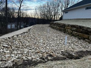 Stone Wall Installation is a tailored, licensed, and knowledgeable service that installs stone walls for both residential and commercial properties. We have a wide selection of stone wall types and colors to choose from, and our experienced team will work with you to create the perfect wall for your property. for Eggers Enterprises LLC in Mineral Point, WI