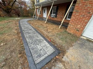 Enhance your home's curb appeal with our professional sidewalk installation service, offering durable and beautifully crafted pathways that seamlessly blend with your landscape while ensuring safety and functionality for years to come. for The Amazing Concrete LLC in Roanoke, VA