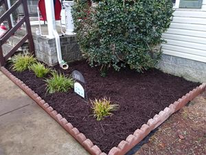 Our Mulch Installation service provides homeowners with a professional and efficient solution to enhance the aesthetics of their lawn by adding a layer of organic mulch for weed suppression, moisture retention, and soil health. for Kingdom Lawn Care  in Shelbyville, TN