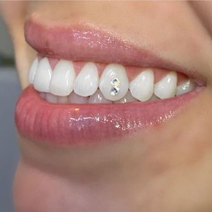 Our Tooth Gem service will help you apply gem to beautify your teeth. We have a wide range of gems to select from and only use high quality and safe products. Reach out to learn more. for Mz Rita’s Boutique in Warren, MI