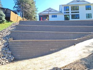 Jamco provides expert retaining wall construction in Monticello, MN, and northwestern Minneapolis. We design and build durable, attractive retaining walls that add structure, prevent erosion, and enhance your landscape’s appeal. for Jamco in Monticello, MN