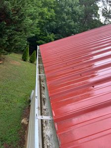 Our Gutter Cleaning service removes debris and prevents clogs, improving drainage and protecting your home from potential water damage. for Blast Exterior Cleaning in  Hendersonville, NC