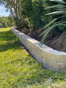 Our Retaining Wall Construction service offers durable, aesthetically pleasing solutions that prevent soil erosion and enhance landscape stability, tailored to complement your home’s outdoor design while improving property value. for King Kutz Landscaping in Apopka, FL