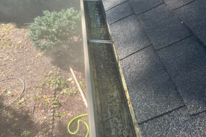 Our Gutter Cleaning service ensures the removal of debris and clogs from your gutters, preventing potential damage and maintaining their efficiency for better water drainage. for Elite Power Washing in Kansas City, KS