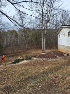 Our grading service helps homeowners level their land and create a solid foundation for landscaping, ensuring proper drainage and preventing future issues. for Smitty's Tree Service in Danville, VA