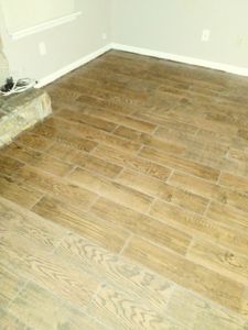 Our Flooring service provides high-quality materials and expert installation for homeowners seeking to enhance the aesthetics and functionality of their homes through beautiful and durable flooring options. for New Millennium Homes in Jacksonville, FL