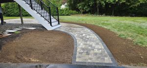 Enhance your home's curb appeal with our expert walkway installation service, featuring custom stone designs that blend beauty and durability to create a stunning, welcoming path tailored to your style. for BC Landscaping Masonry in Amesbury, MA