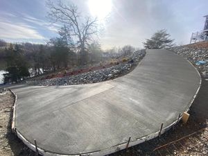 Our driveway construction service specializes in expert concrete slab construction to ensure durability and aesthetic appeal for your home entrance while providing a smooth and long-lasting surface tailored to your needs. for MW ProBuild, LTD. in Roanoke, VA