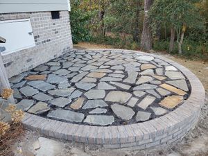 Our Paver & Stone Patio service combines skilled construction expertise with high-quality materials to create beautiful outdoor spaces for homeowners to enjoy and relax in. for Bianchi Construction Company Inc in Southport, NC