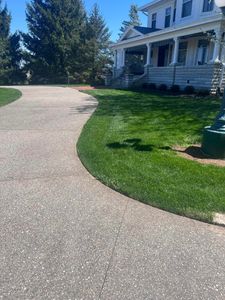 Our Edging service provides precise and clean lines around flowerbeds, walkways, and driveways to enhance the overall appearance of your lawn. for Davidson Lawn Care LLC in Greensburg, IN