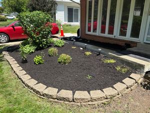 Enhance your home's curb appeal with our expert mulch installation service, providing a polished look while retaining soil moisture and suppressing weeds for a healthier garden landscape. for Walsh Lawn And Landscape in Olney, MD