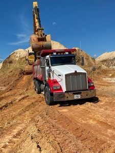 Our Hauling service provides convenient and efficient removal of debris from your property. We'll take care of the heavy lifting so you don't have to! for Between The Hedges Landscape & Trucking LLC in Altha, FL