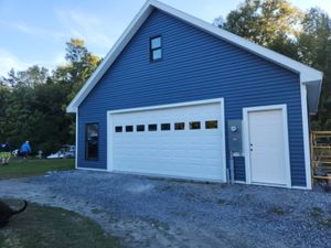 Enhance your home's functionality and appeal with our expert Garages, Porches & Decks service, offering custom design and seamless construction to create stylish outdoor living spaces tailored to your lifestyle needs. for Windy Hollow Homes in Granville, NY