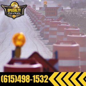 Our Traffic Control Division ensures seamless and safe traffic management during asphalt paving projects, minimizing disruptions for homeowners and enhancing safety with expertly coordinated signage, barriers, and flagging operations. for Specialty Paving and Sealcoating in Gallatin, TN