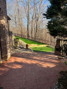 Transform your backyard into a golfer's paradise with our professional artificial turf grass putting greens, offering low-maintenance beauty and realistic playability for year-round enjoyment in any climate. for Howerton’s Landscaping in Clemmons, NC
