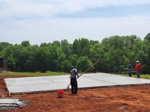 Enhance your home's landscape with our expert new construction concrete service, specializing in durable retaining wall construction to ensure stability and add aesthetic appeal to your outdoor spaces. for Miilan Construction in Boonville, NC