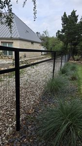 Our Double Rail Ranch fence service delivers durable, attractive boundary fencing that defines your property, enhances curb appeal, and provides a classic rural look with expert installation and lasting craftsmanship. for Ansley Staining and Exterior Works in New Braunfels, TX