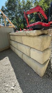 Our Retaining Walls service expertly constructs durable and aesthetically pleasing walls that prevent soil erosion, enhance your landscape's stability, and seamlessly integrate with your property’s design for added safety and beauty. for T&D Excavating LLC. in Madison, NH