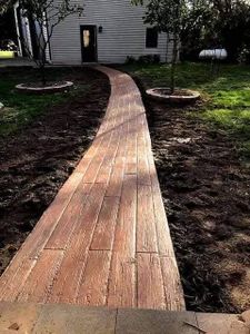 Enhance your outdoor spaces with our stamped concrete installation, offering stunning designs and durability. Transform patios, driveways, and walkways with custom textures that mimic stone, brick, or ANY design-texture for enduring beauty. for Custom Concrete Enterprises in Springfield, IL