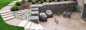 We provide professional retaining wall construction services to help homeowners and property owners create attractive and functional outdoor spaces. for Daybreaker Landscapes in McHenry County, Illinois