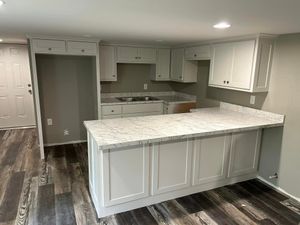 Our Laminate Countertops service offers durable and affordable options for homeowners looking to upgrade their kitchen or bathroom counters with beautiful, high-quality laminate materials. for Legendary Custom Millworks LLC in Malvern, AR