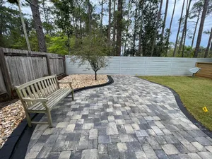 Our Patio Design & Construction service will help you design and build the perfect patio for your home. We'll work with you to choose the right materials and design for your needs and budget. for Poarch Creek Landscaping in Santa Rosa Beach, FL
