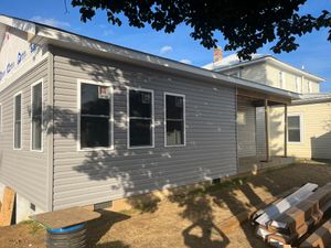 Enhance your home's exterior with our premium vinyl siding service, offering durable protection at an affordable vinyl siding cost. Enjoy a maintenance-free solution that boosts curb appeal and energy efficiency effortlessly. for CM Construction in Erwin, TN