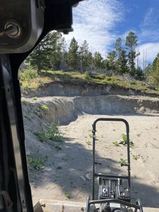 Our Retaining Walls service provides durable and aesthetically pleasing solutions to stabilize your landscape, prevent soil erosion, and enhance your outdoor space with expertly crafted designs tailored to meet your property's needs. for Dig in Dirt Works LLC in Clancy, MT