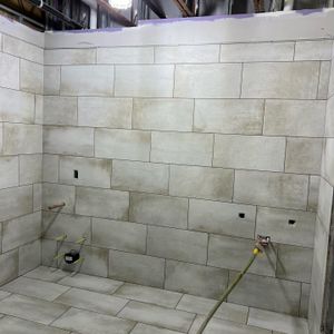 Our Bathroom Remodels service offers homeowners a comprehensive solution for transforming their bathroom space, including updating showers and tiles to create a stylish and functional environment. for Premier Tile Contractors LLC in Henrico, Virginia