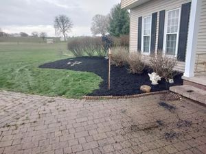 Our Mulch Installation service offers homeowners the convenience of professionally applying mulch to their landscapes, enhancing soil health and aesthetics while minimizing weed growth. for Billiter's Tree Service, LLC in Rootstown, Ohio