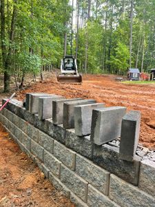 We offer professional retaining wall construction services to enhance your landscape and create a safe and attractive outdoor space. for Lively Landscaping LLC - NC in Franklinton, North Carolina