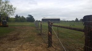 Our Skidsteer Services offer efficient and professional land clearing and fencing solutions to homeowners, ensuring quick and precise results for all your property improvement needs. for Rudy's Custom Fence Building in Luling, TX