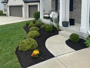 Our Shrub Trimming service expertly shapes and maintains your shrubs, enhancing their health and appearance while complementing your landscape design for a polished, tidy garden that enhances curb appeal. for Blue Cardinal Outdoor Living Construction in Kokomo, IN