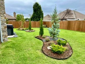 Flower beds are a great way to spruce up any yard! We can help design and install mulch, plants, and decor to bring your flower beds to light. for DeLoera Total Lawncare in Oklahoma City, Oklahoma