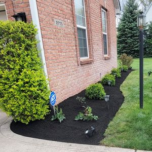 Enhance your garden's beauty and health with our professional mulch installation service, offering a vibrant selection to boost soil moisture, suppress weeds, and provide an attractive finish to your landscape. for Blue Cardinal Outdoor Living Construction in Kokomo, IN