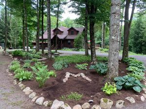 Our Mulch Installation service provides homeowners with a beautiful, finished look for their landscaping. We use a high-quality mulch to enhance the appearance of flower beds, gardens, and other areas around the home. for Lamb's Landscapes & Hardscapes in Syracuse, New York