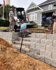 Our Hardscaping service enhances your outdoor space with durable and beautiful features such as patios, walkways, retaining walls, and more to transform your property into an inviting oasis. We are your go to service when it comes to Pavers, Retaining walls, New Construction, Landscape Installations, Landscape Design, Lighting, Outdoor Living, Outdoor Kitchens, Fire pits, Fire Places. for Djosey Landscapes in Wilmington, NC