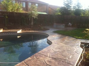 Enhance your backyard with our durable swimming pool decking service, creating safe, stylish surfaces for entertaining and relaxation. We design and install custom pool decks above ground that last. for Salas Concrete in Fresno, CA