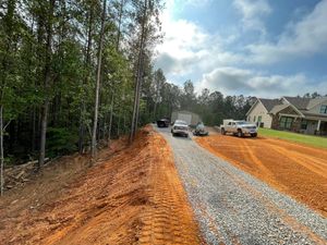 Our Grading service ensures a smooth and level lawn surface, improving overall aesthetics and promoting proper water drainage for healthier grass growth. for CreekSide HydroSeeding & EarthWorks in Calhoun, GA