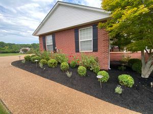 We offer professional mulch installation services that will help beautify your yard and keep it looking fresh. for Freedom Works Lawnscaping in Dyer County, Tennessee