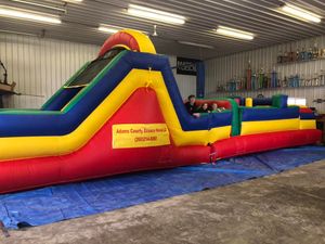 Our Inflatables service offers a wide selection of inflatable attractions, including bounce houses and slides, to add fun and excitement to your home parties or events. for Adams County Bounce Houses, LLC in Decatur, IN