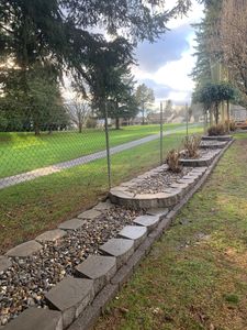 Our Retaining Wall Construction service provides professional expertise in building durable and visually appealing walls that prevent soil erosion, enhance the landscape's aesthetics, and add value to your property. for Juan Esteban Landscape service LLC  in Bonney Lake, WA