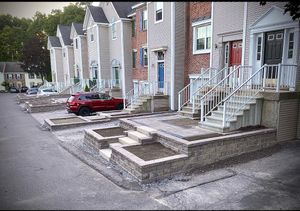 Our Retaining Wall Construction service enhances your landscape's stability and aesthetic appeal, providing expert design and durable materials to prevent soil erosion while seamlessly integrating with your outdoor environment. for Granite State Walls and Walkways LLC in Concord, NH