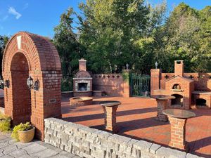 Our Fireplaces & Pizza Oven Structure service offers homeowners a professional solution for the installation and construction of beautiful fireplaces and pizza ovens, enhancing your outdoor living space. for Bianchi Construction Company Inc in Southport, NC