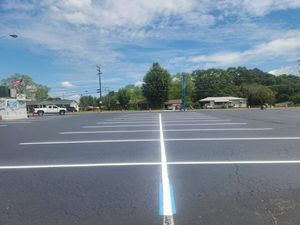 Our commercial sealcoating service is designed to protect and enhance the appearance of your driveway or parking lot, extending its lifespan and providing a professional finish. for Johnson's Sealcoating & Painting in Inman, SC