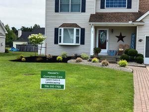 Our Mulch Installation service will provide your lawn with a layer of organic material that will help to improve the soil quality, protect against erosion, and moderate the temperature of the ground. for Hauser's Complete Care INC in Depew, NY