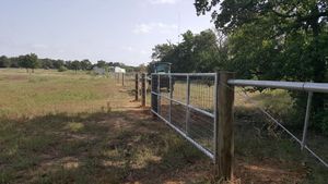 Our Gate Installation and Repair service offers homeowners a reliable solution for installing and maintaining gates, ensuring enhanced security, convenient access control, and improved aesthetics for their property's fencing system. for Rudy's Custom Fence Building in Luling, TX