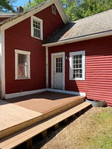 Our custom home construction service includes expertly crafted decks and patios, enhancing your outdoor living space with personalized design and premium materials for beauty, durability, and seamless integration with your home. for Cushman Brook Construction in Dalton, NH