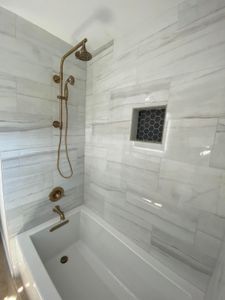 Floor tile, kitchen backsplash, tub decks and custom showers. for Lillibridge Remodeling Services in Sherman, TX